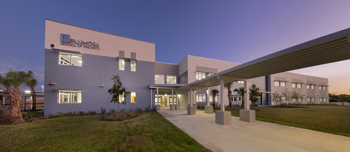 Architectural dusk view of the Plumosa School of the Arts in Delray Beach. FL.